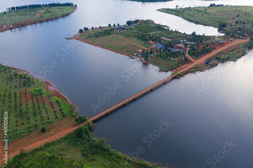 Beautiful lake nestled among rainforest in mountian at Veal Veng - Cambodia  under blue sky with white clouds.  photo