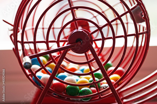 red raffle game with different colored balls for bingo and lottery games from the side