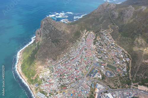 Cape Town, Western Cape / South Africa - 11/26/2020: Aerial photo of Hangberg with The Sentinel in the background photo