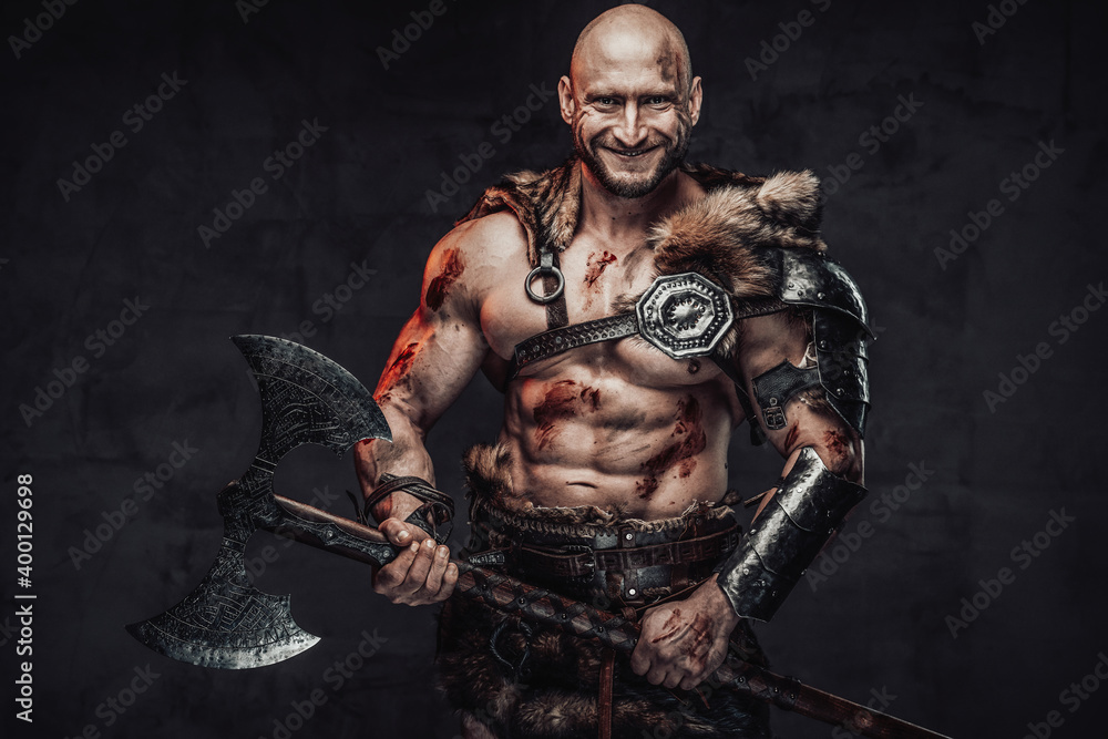 Positive portrait of a happy and powerful barbarian with bloody and ...