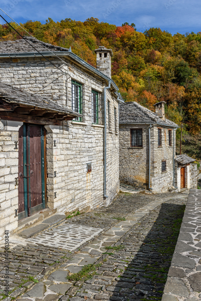 The picturesque village of Koukouli during fall season with its architectural traditional old stone  buildings located on Tymfi mount, Zagori, Epirus, Greece, Europe