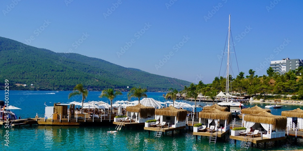  Bodrum, Turkey - August, 2020 Panoramic view, Rest in paradise. Beautiful tropical beach banner. Emerald Ocean. Amazing beach landscape, yachts.
