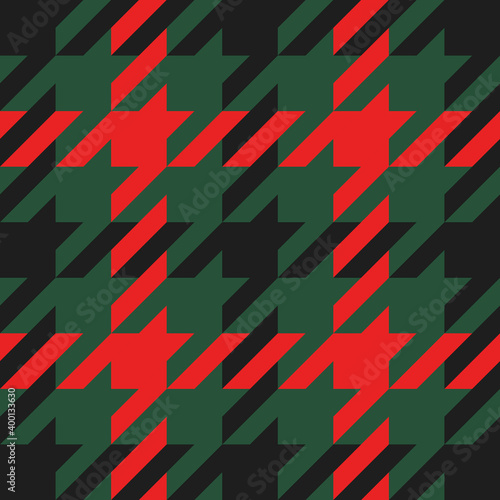 Goose foot. Christmas Pattern of crow's feet in red and green cage. Glen plaid. Houndstooth tartan tweed. Dogs tooth. Scottish checkered background. Seamless fabric texture. Vector illustration