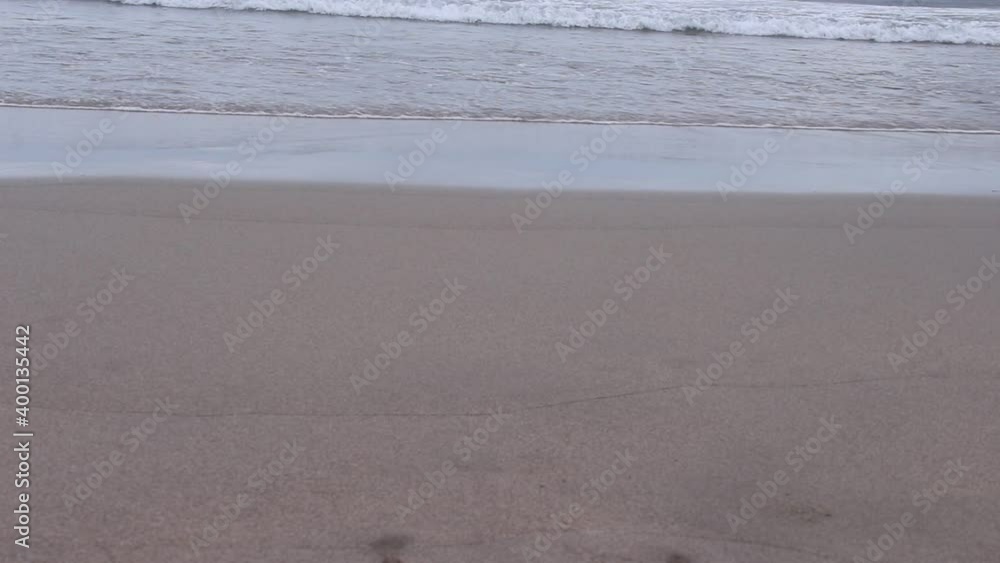 waves breaking on sandy shore , sea background waves breaking on sandy shore , sea background