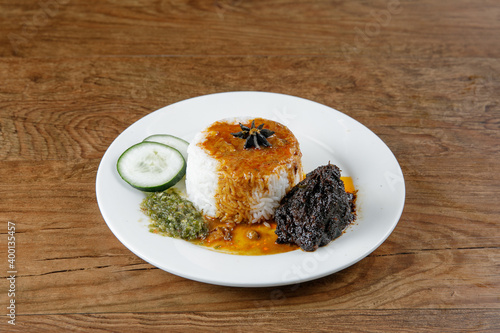 Nasi kukus daging kicap, popular traditional Malay local food.00 photo