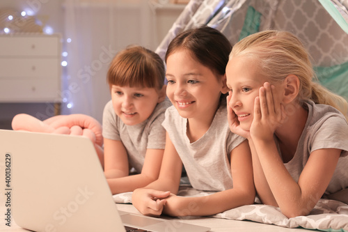 Cute little girls lying in ...