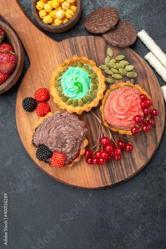 top view delicious creamy cakes with fruits on dark background sweet biscuit cookies