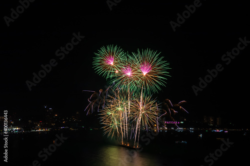 Colorful firework over Pattaya beach during International Festival, celebration for New Year © wirojsid