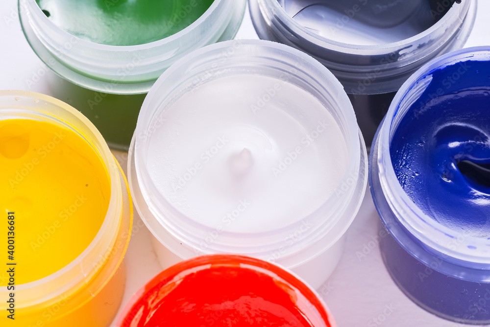 Set of artistic paint cans opened, close up Set of artistic paint cans opened, close up