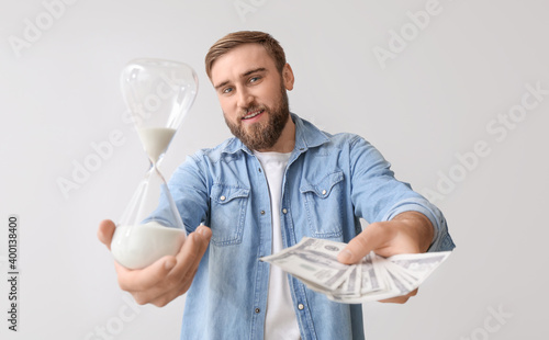 Young man with hourglass an...