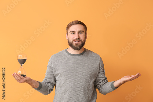 Young man with hourglass on...