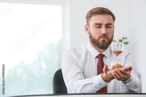 Businessman with hourglass ...