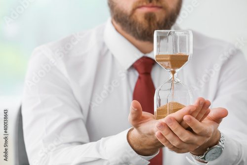 Businessman with hourglass ...