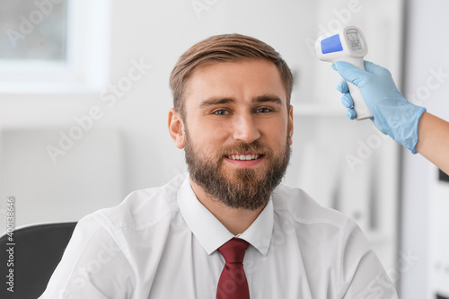 Measuring of man's temperat...