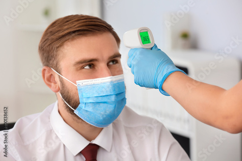 Measuring of man's temperat...