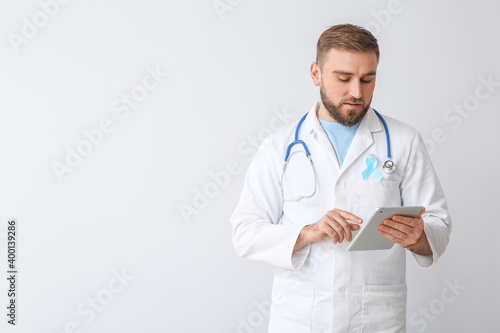 Doctor with blue ribbon and...