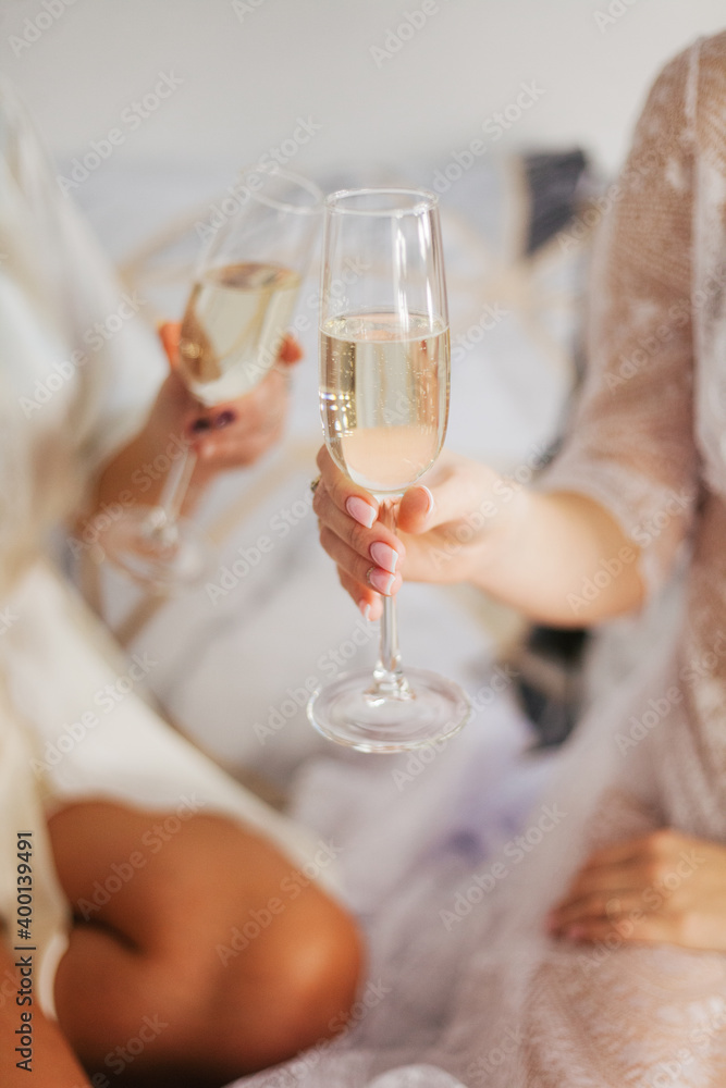 Champagne in a glass. Girls drink champagne. Festive mood.Bachelorette party.