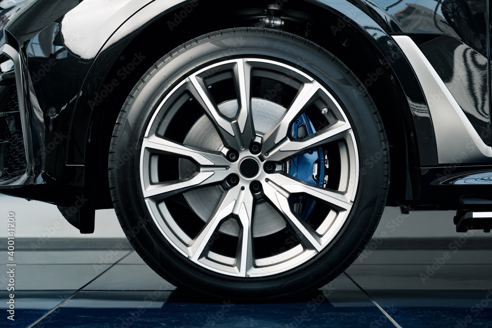 Fototapeta premium Aluminium rim of luxury car wheel close up