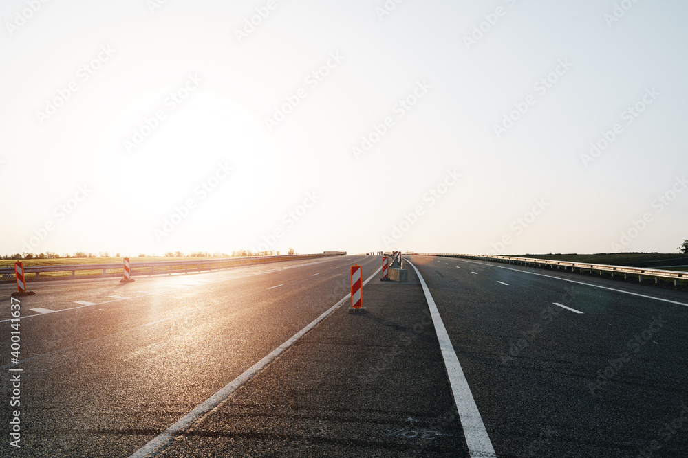 Fototapeta premium Empty highway with asphalt road and cloudy sky