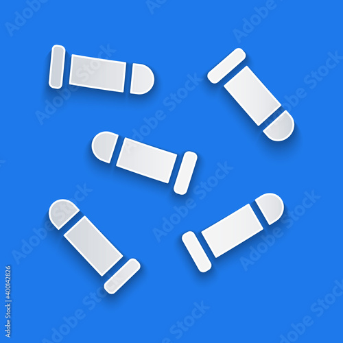 Paper cut Bullet icon isolated on blue background. Paper art style. Vector.