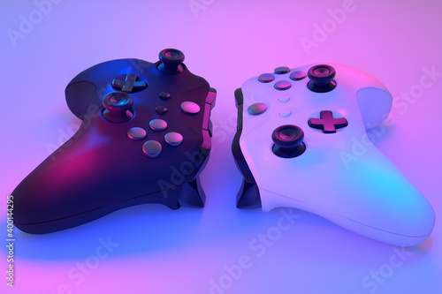 Realistic video game controllers in neon lights on white table background
