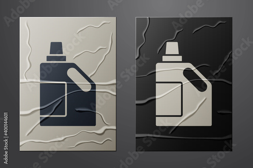 White Plastic bottle for laundry detergent, bleach, dishwashing liquid or another cleaning agent icon isolated on crumpled paper background. Paper art style. Vector.