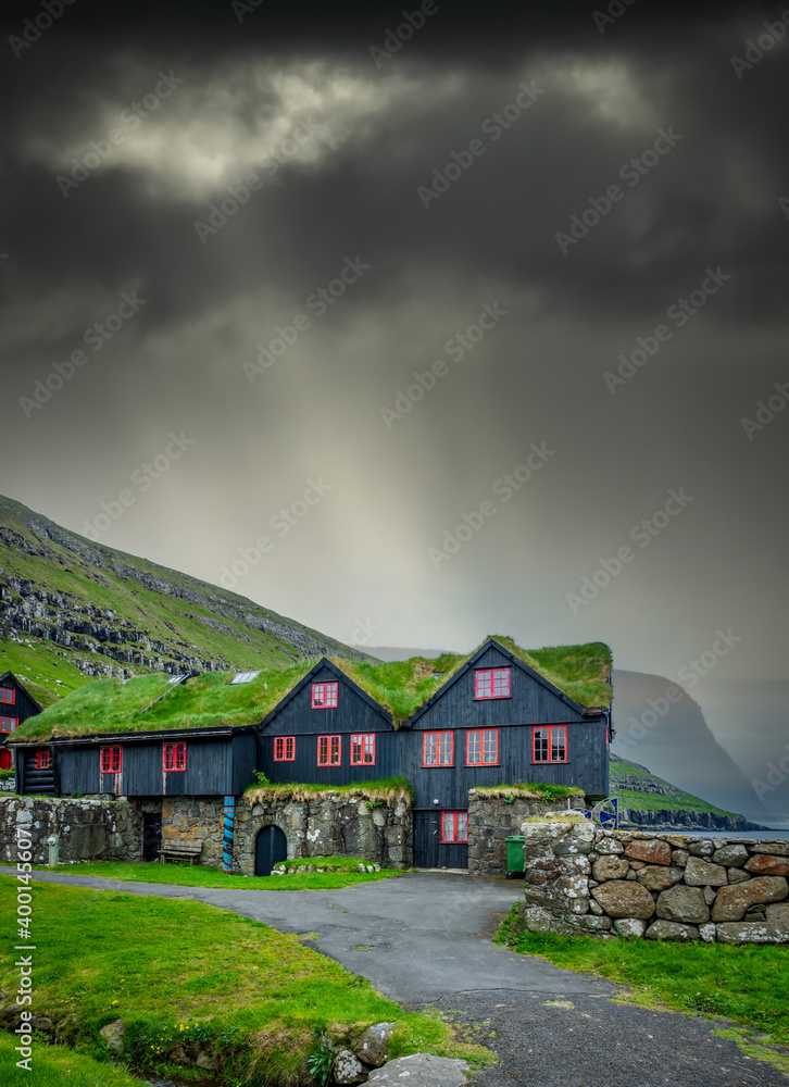 Typical nordic houses under ray lights from the clouds