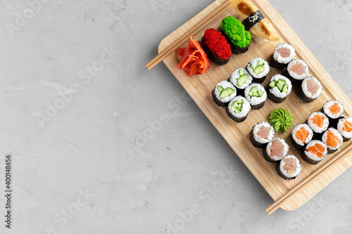 Maki sushi set served on wooden tray