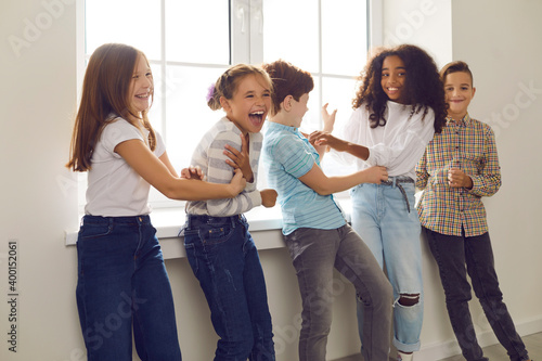 Принти на полотні Group of children playing and laughing during recess at school or fun party at h