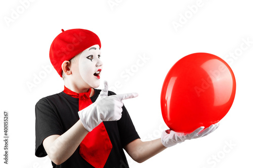 teenage boy in the image of a mime with makeup on his face, with a balloon, isolate on a white background photo