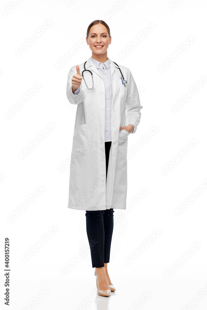 medicine, profession and healthcare concept - happy smiling female doctor in white coat showing thumbs up medicine, profession and healthcare concept - happy smiling female doctor in white coat showing thumbs up