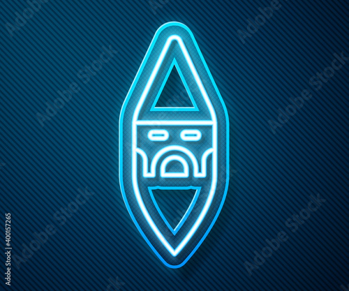 Glowing neon line Wizard warlock icon isolated on blue background. Vector.
