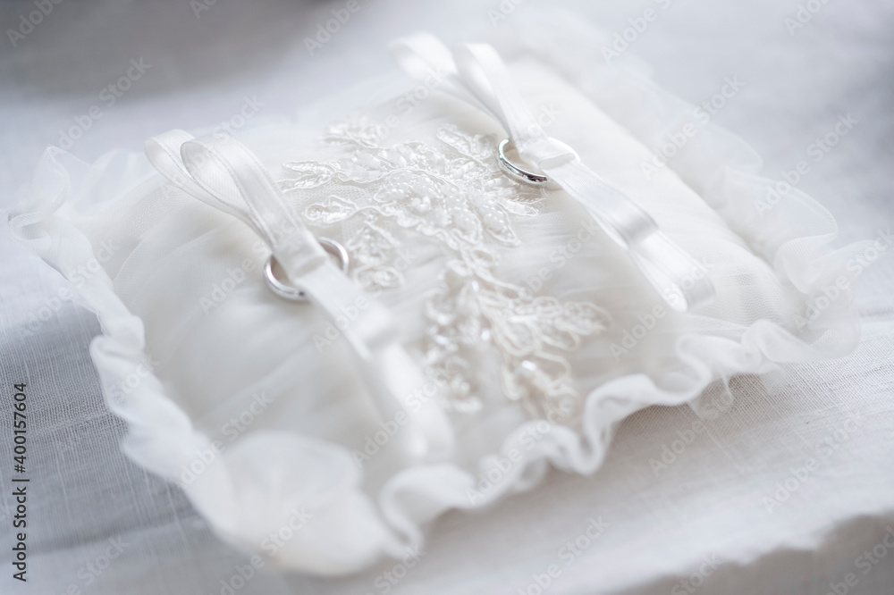 Wedding rings on white thigh. Wedding rings for Christian ceremony Wedding rings on white thigh. Wedding rings for Christian ceremony