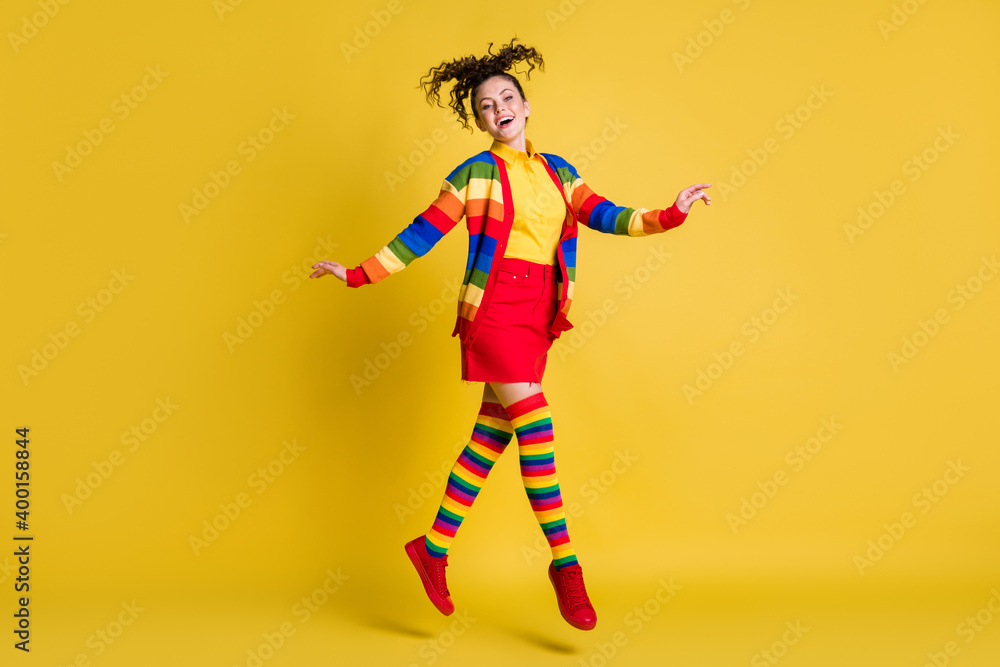 Full length body size view of attractive carefree funky cheery wavy-haired girl jumping isolated bright yellow color background