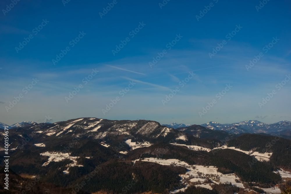 blue sky and wide view to mountains and snow in the spring
