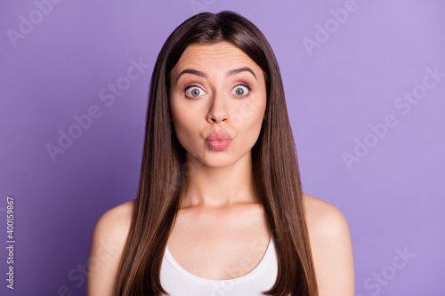 Photo portrait of funny girl with plump lips isolated on vivid violet colored background