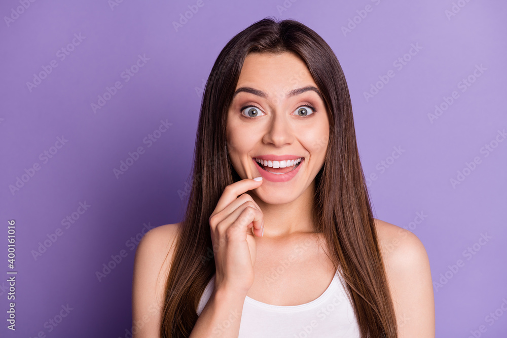 Photo portrait of adorable girl touching face chin with finger isolated on vivid purple colored background Photo portrait of adorable girl touching face chin with finger isolated on vivid purple colored background