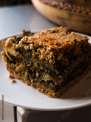 Preparation of delicious home made farm style rustic spinach pie.