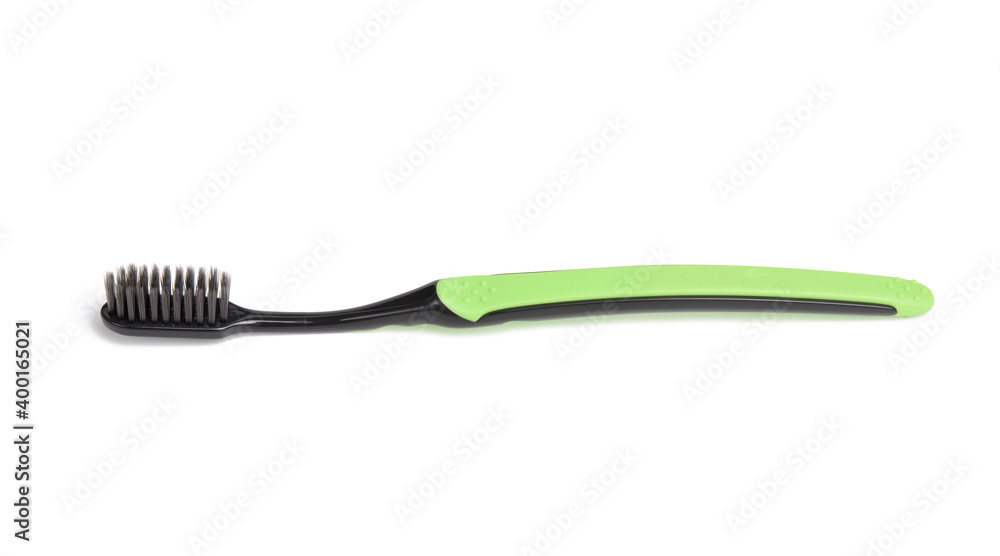 green plastic toothbrush isolated on white background green plastic toothbrush isolated on white background