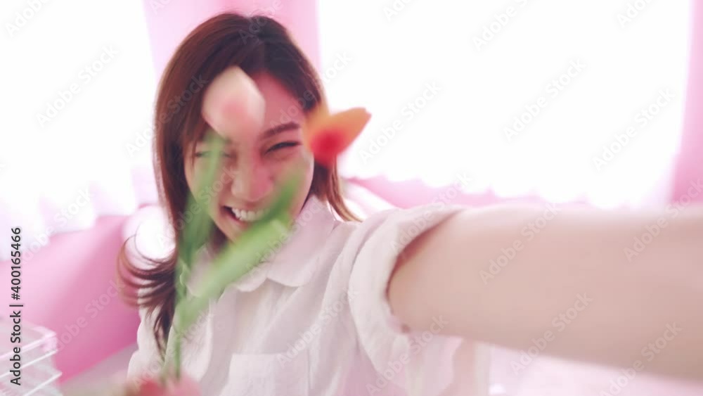 SLOW MOTION Beauty woman wearing a white shirt with selfie live video to social media spinning around the room SLOW MOTION Beauty woman wearing a white shirt with selfie live video to social media spinning around the room