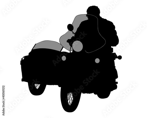 Man on a motorcycle with a sidecar rides on the road. Isolated object on white background