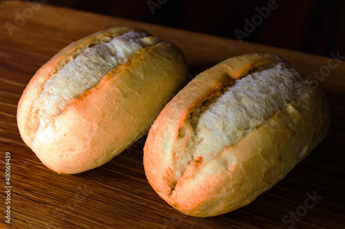 Fresh baked buns cool down on the table