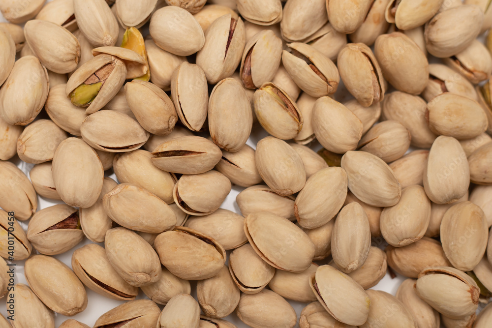 Pattern background, Pistachio texture. Nuts. Green fresh pistachios as texture. Close-up photo Pattern background, Pistachio texture. Nuts. Green fresh pistachios as texture. Close-up photo