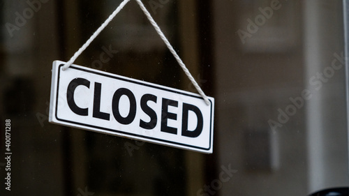 A closed sign on a shop window