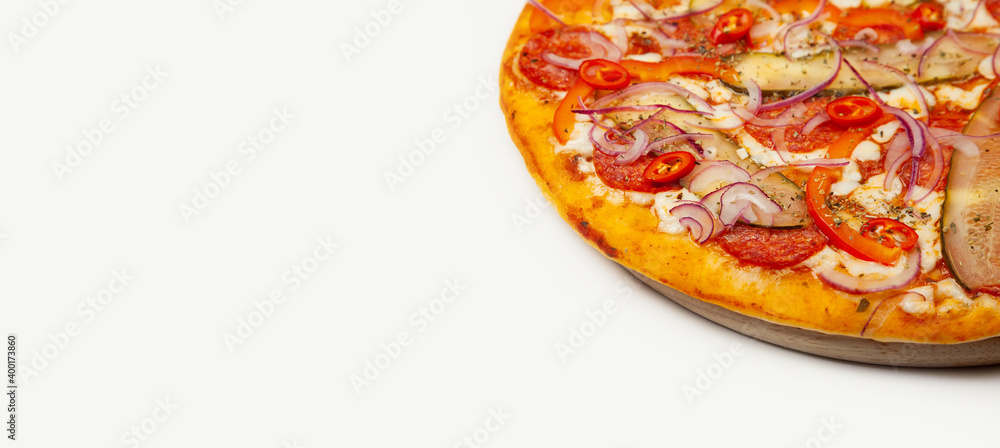 Tasty pizza Spicy pepper served on a wooden plate, ingredients Signature sauce, mozzarella cheese, pepperoni, pickled cucumber, Bulgarian pepper, red onion, chili pepper. Pizzeria promotion poster. Tasty pizza Spicy pepper served on a wooden plate, ingredients Signature sauce, mozzarella cheese, pepperoni, pickled cucumber, Bulgarian pepper, red onion, chili pepper. Pizzeria promotion poster.