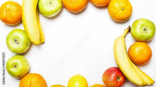 different fresh sweet fruits on frame on a white background with copy space for text. Healthy eating