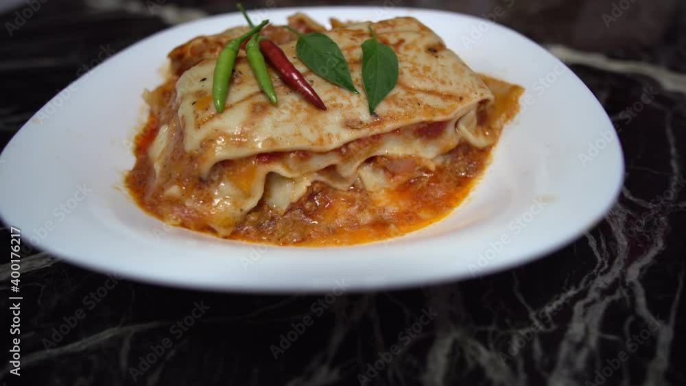 Meat lasagna with chilli papers on top Meat lasagna with chilli papers on top