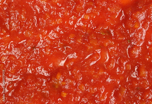 Sauce made from tomatoes, garlic, onions, carrots and basil background and texture © dule964