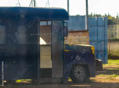 an antique collectible truck on a paintball field