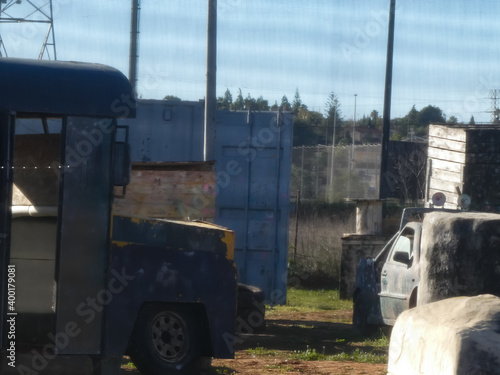 an antique collectible truck on a paintball field